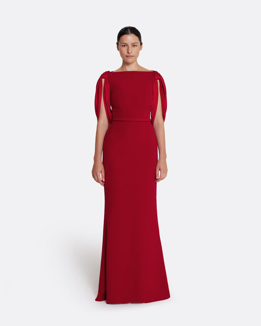 Boat neck gown with fluid draped sleeves in CHERRY RED ON AZALEA RED