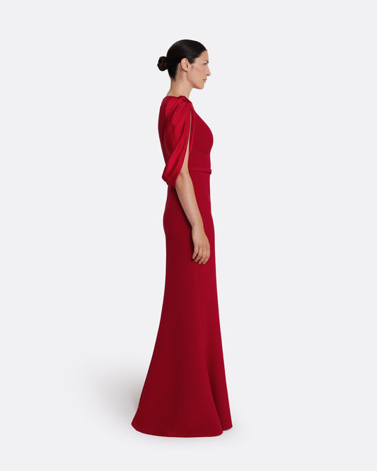 Boat neck gown with fluid draped sleeves in CHERRY RED ON AZALEA RED