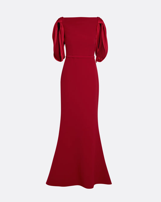 Boat neck gown with fluid draped sleeves in CHERRY RED ON AZALEA RED